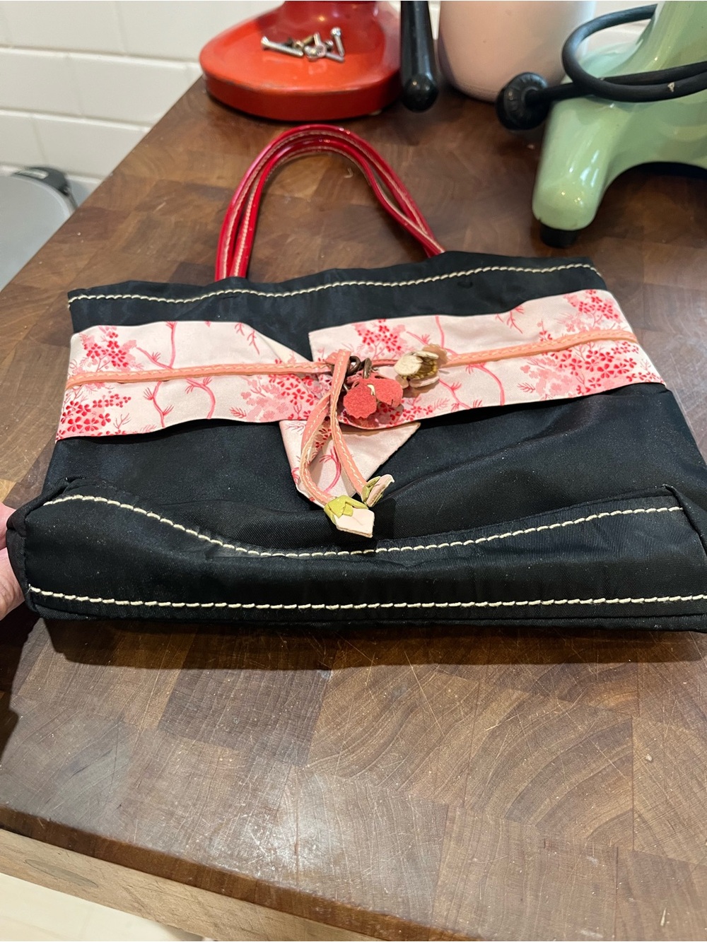 Prada Black Tote with Pink Floral Band and Red Handles